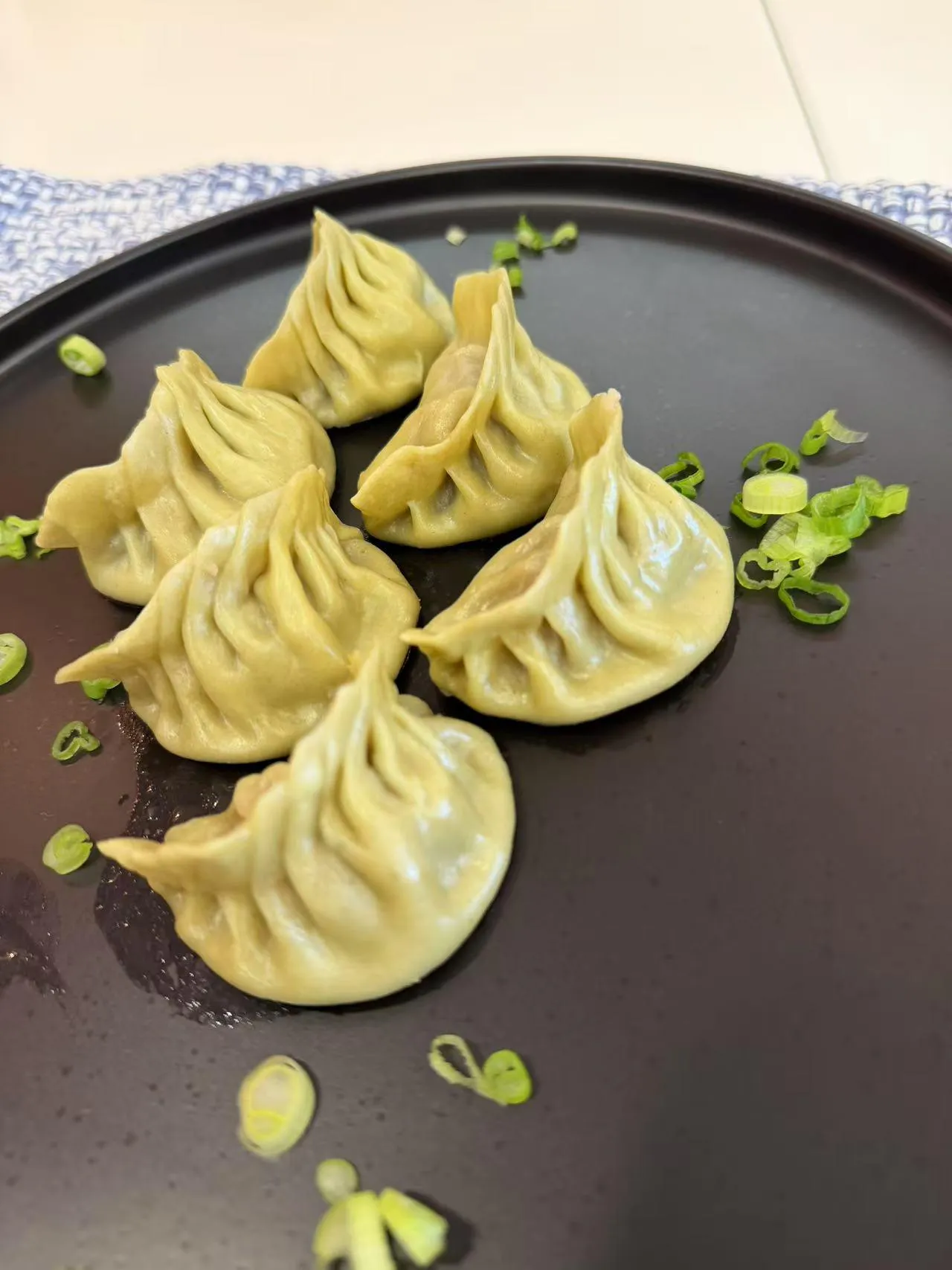 Spinach-infused green vegetable steamed dumplings at Dumpling Station, a Chinese Restaurant in Delaware